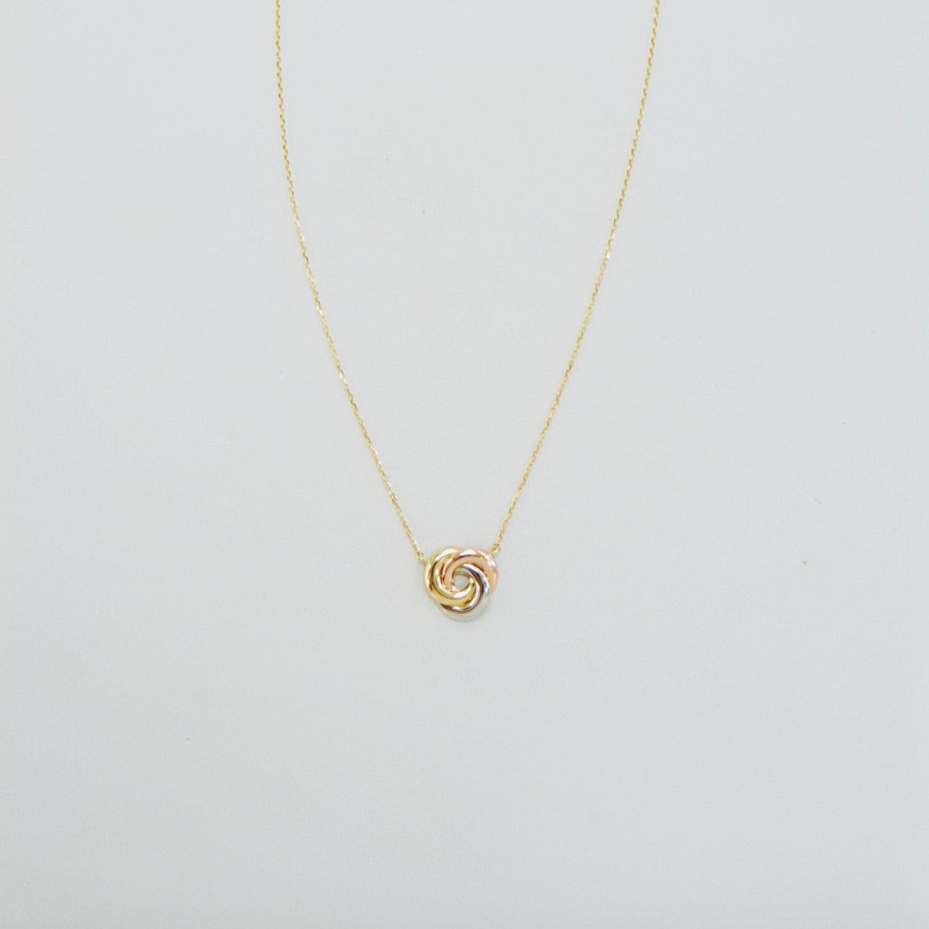 Solid 14K Tricolor Gold Knot Necklace — Image 1